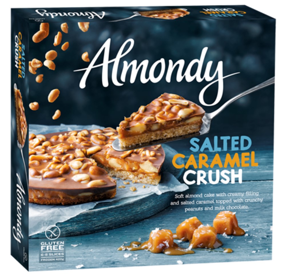 Almondy Salted Caramel Crush. V1332 12x 420g. Soft almond cake with creamy filling and salted caramel topped with crunchy peanuts and milk chocolate. MAY CONTAIN HAZELNUTS.